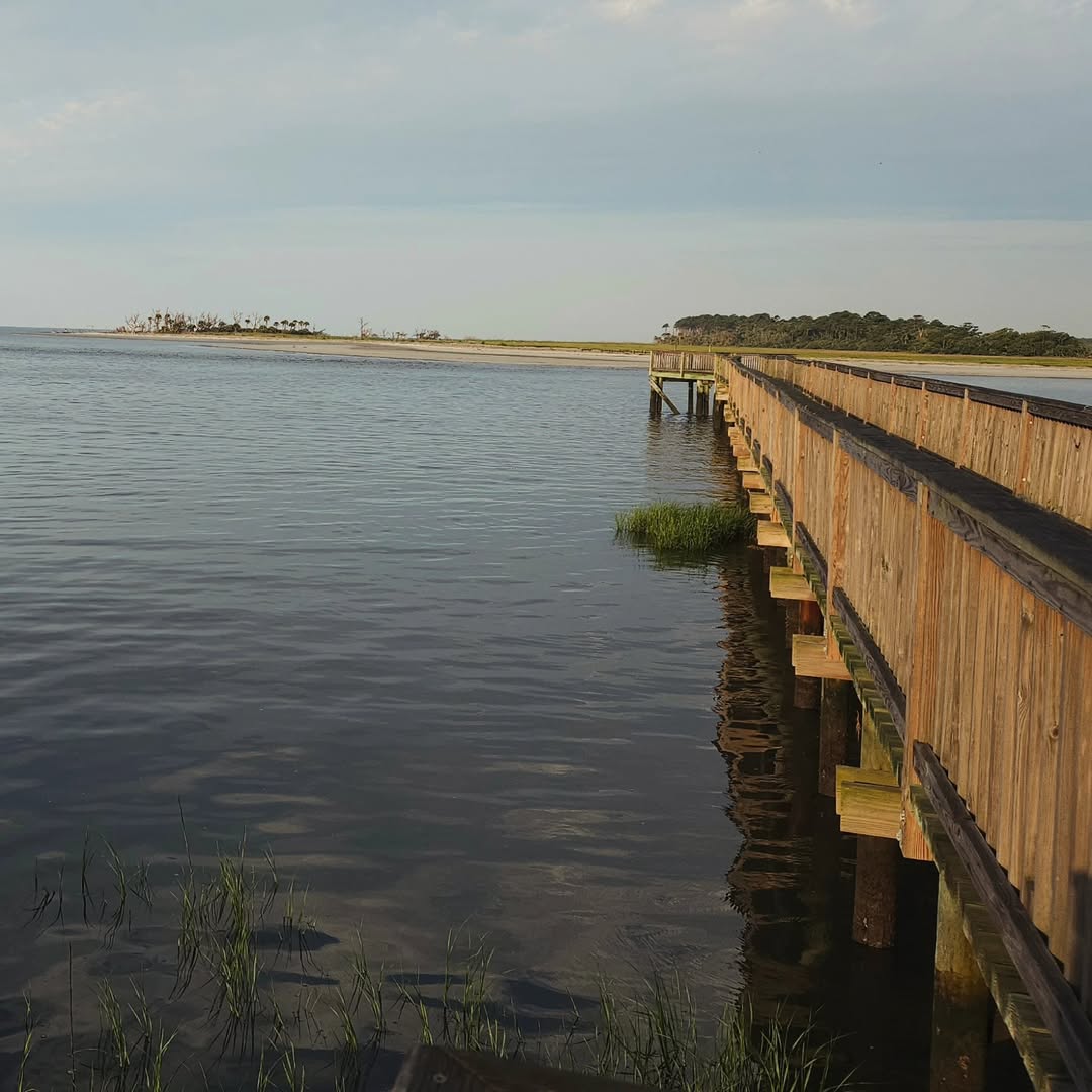 A long pier extending into the ocean.
